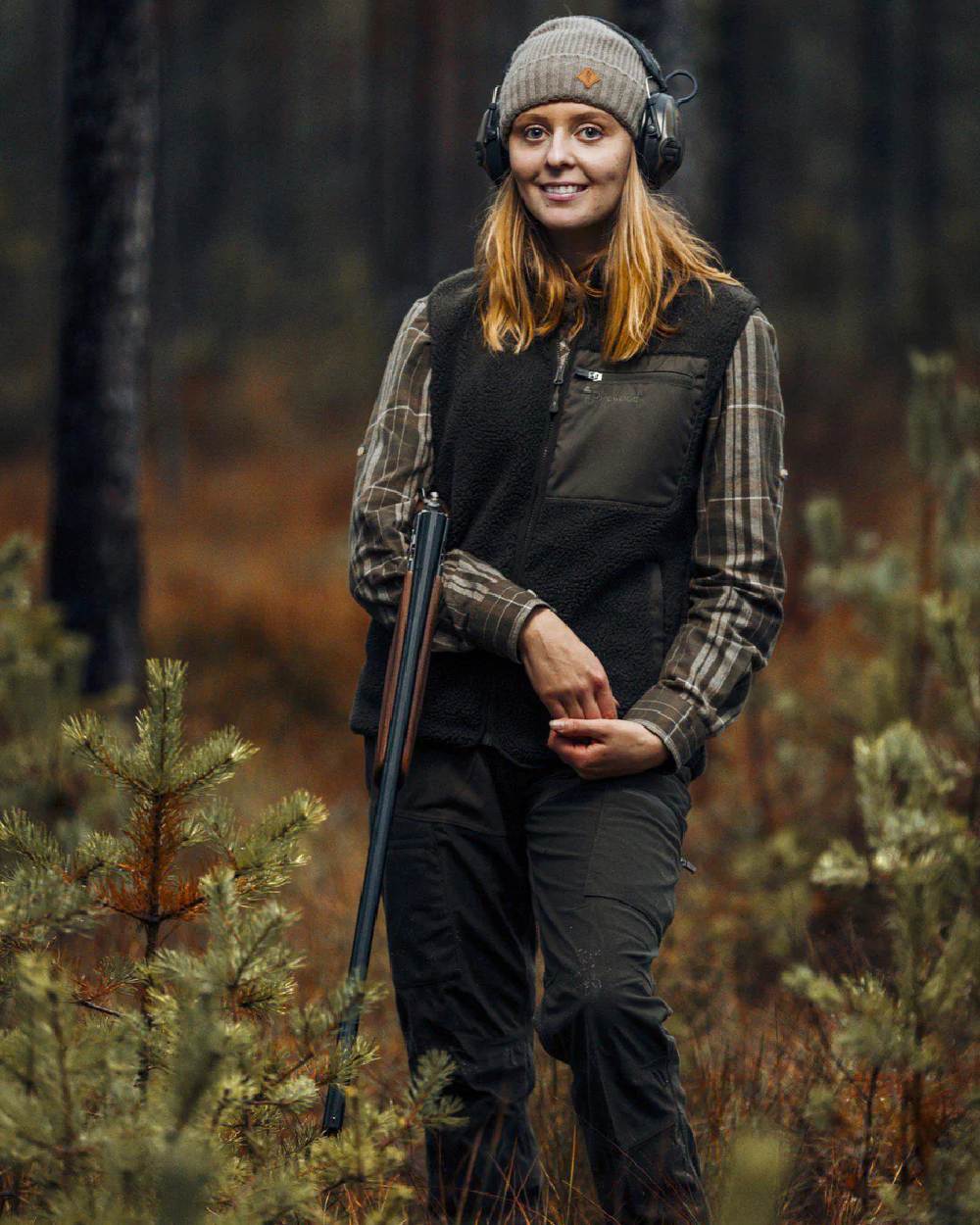 Mossgreen coloured Pinewood Womens Retriever Active Trousers on forest background 