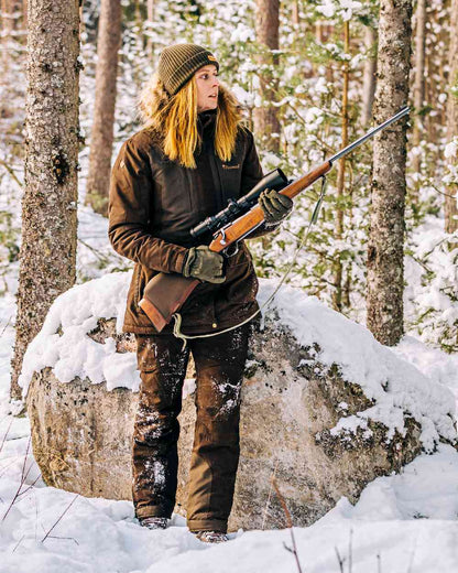 Suede Brown Coloured Pinewood Womens Smaland Abisko 2.0 Hunting Jacket on snow background 