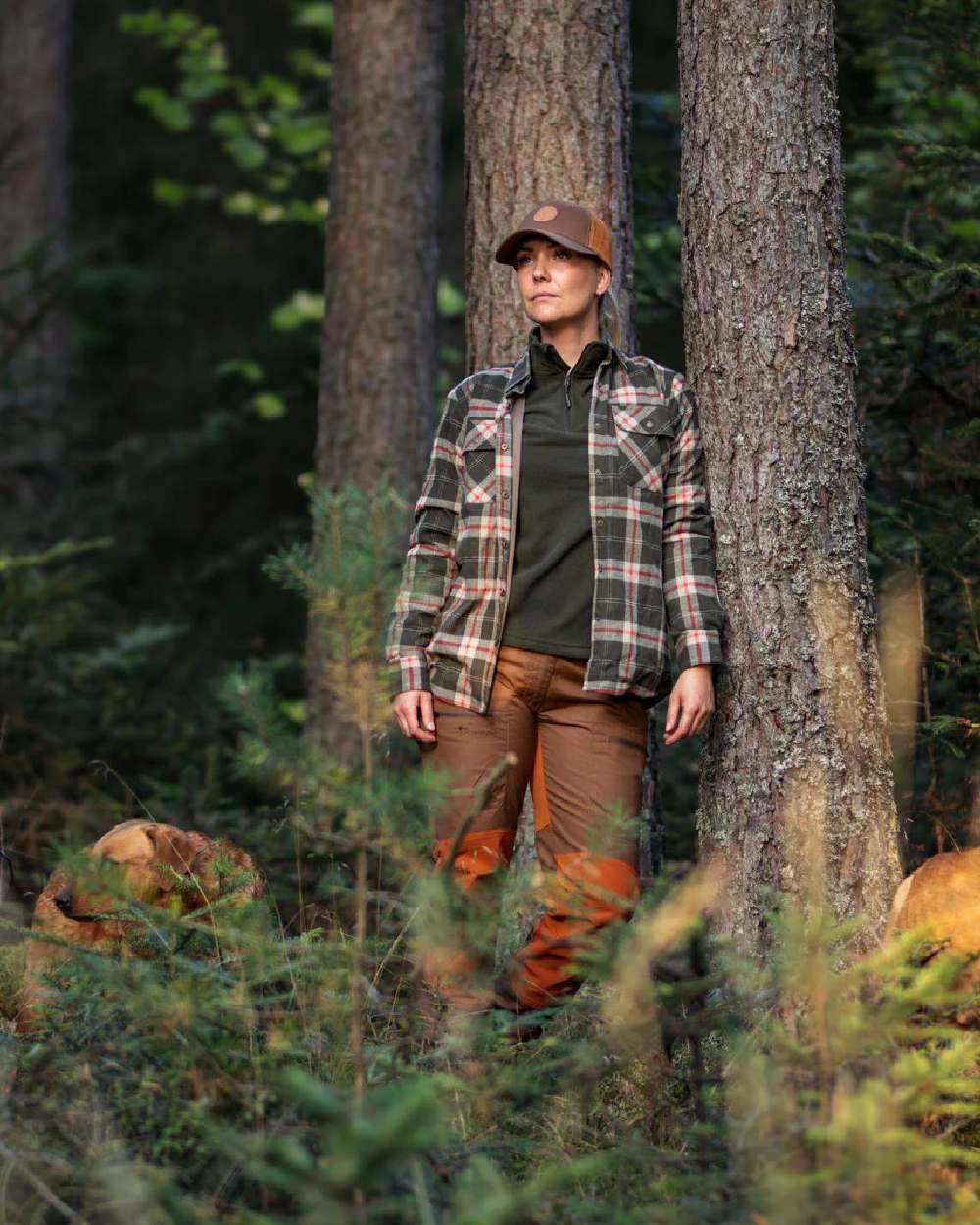 Green coloured Pinewood Womens Tiveden Fleece Sweater on forest background 
