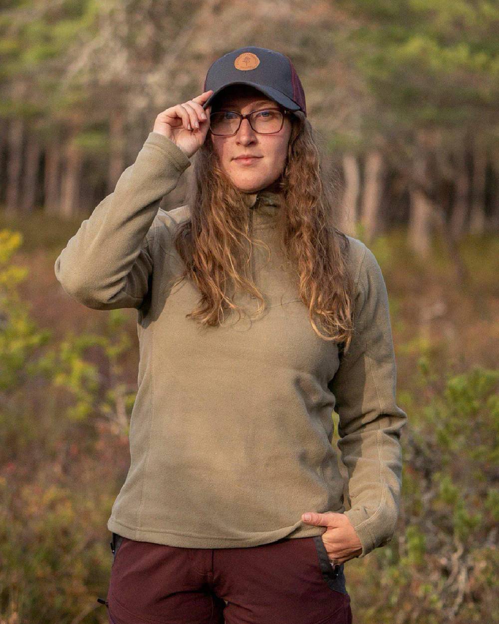 Mid Khaki coloured Pinewood Womens Tiveden Fleece Sweater on blurry background 