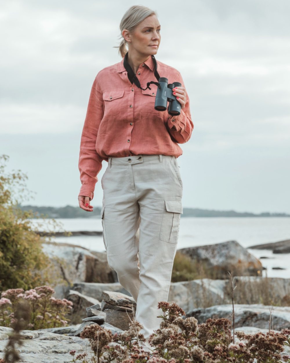 Linen Beige coloured Pinewood Womens Varnamo Insectsafe Linen Trousers on sea background 