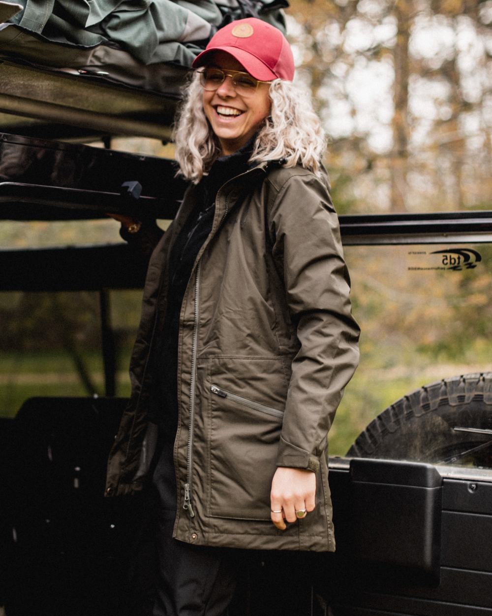 Moss Green coloured Pinewood Womens Wilda Parka on forest background 