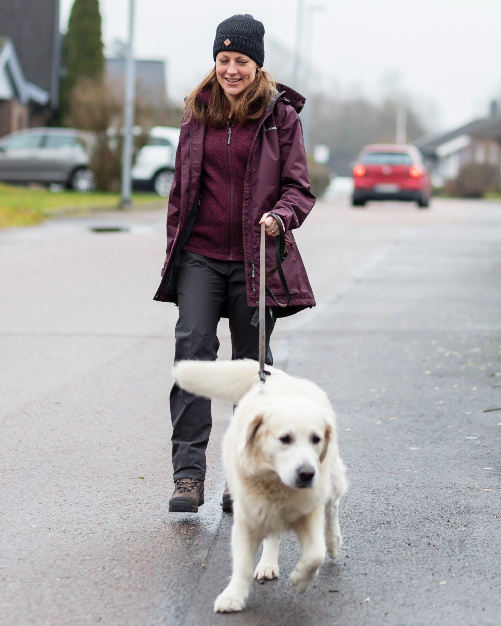 Plum coloured Pinewood Womens Wilda Parka on street background 