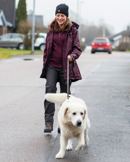 Plum coloured Pinewood Womens Wilda Parka on street background 
