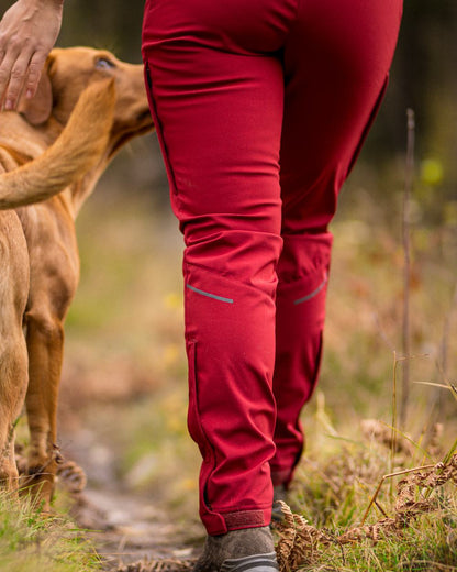 Dark Tomato Coloured Pinewood Womens Wilda Stretch Shell Trousers on outdoor background 