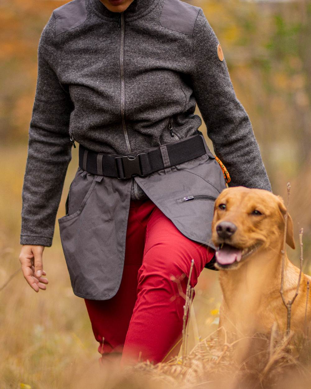 Dark Tomato Coloured Pinewood Womens Wilda Stretch Shell Trousers on outdoor background 