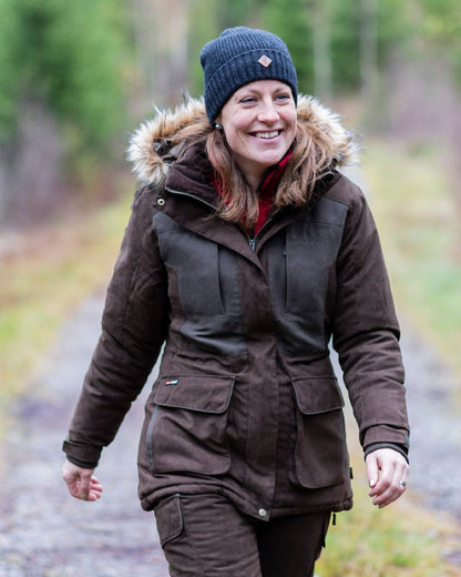 Dark Anthracite Mel Coloured Pinewood Wool Knitted Hat on outdoor background 