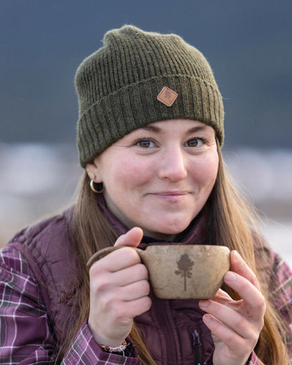 Mossgreen Mel Coloured Pinewood Wool Knitted Hat on outdoor background 