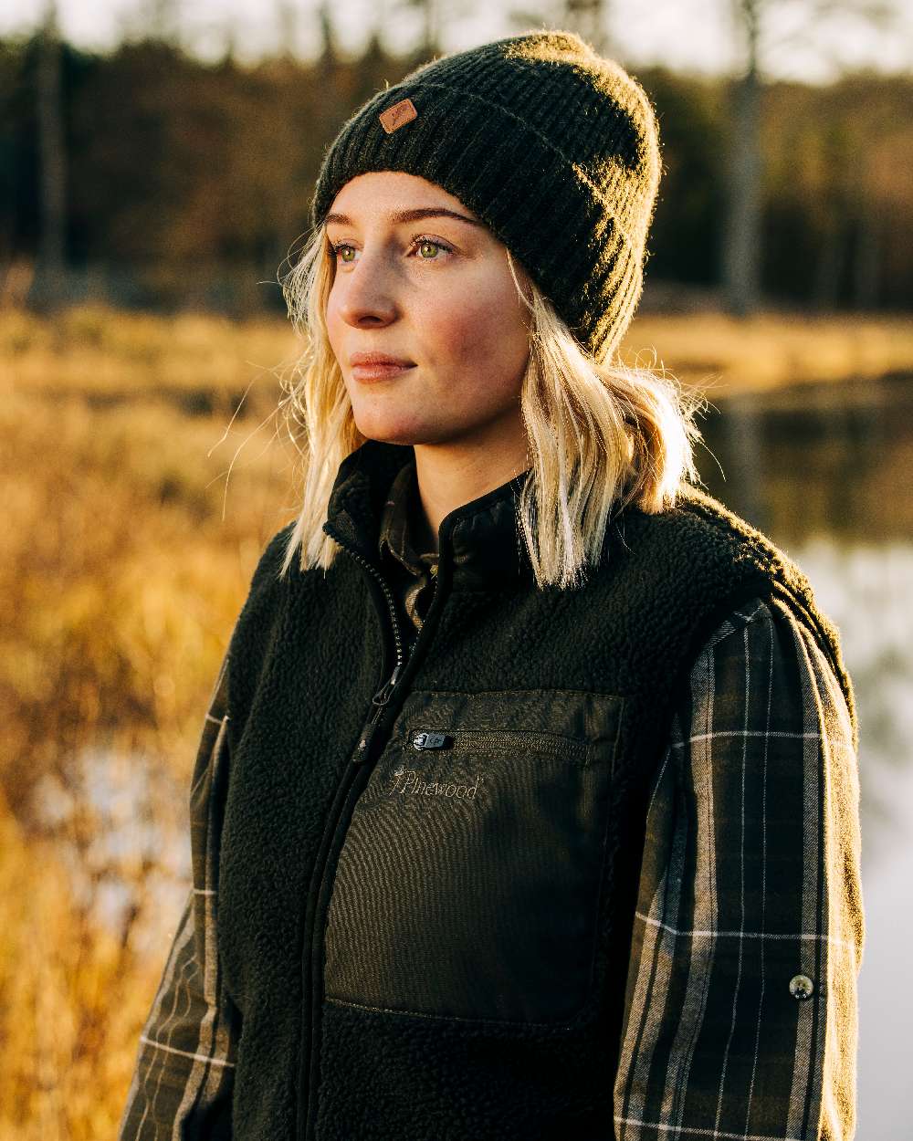 Mossgreen Mel Coloured Pinewood Wool Knitted Hat on outdoor background 
