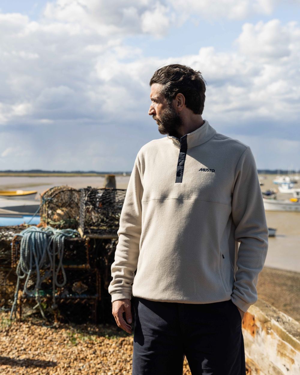 Pumice Coloured Musto Mens Classic Fleece Pullover On A Beach Background 