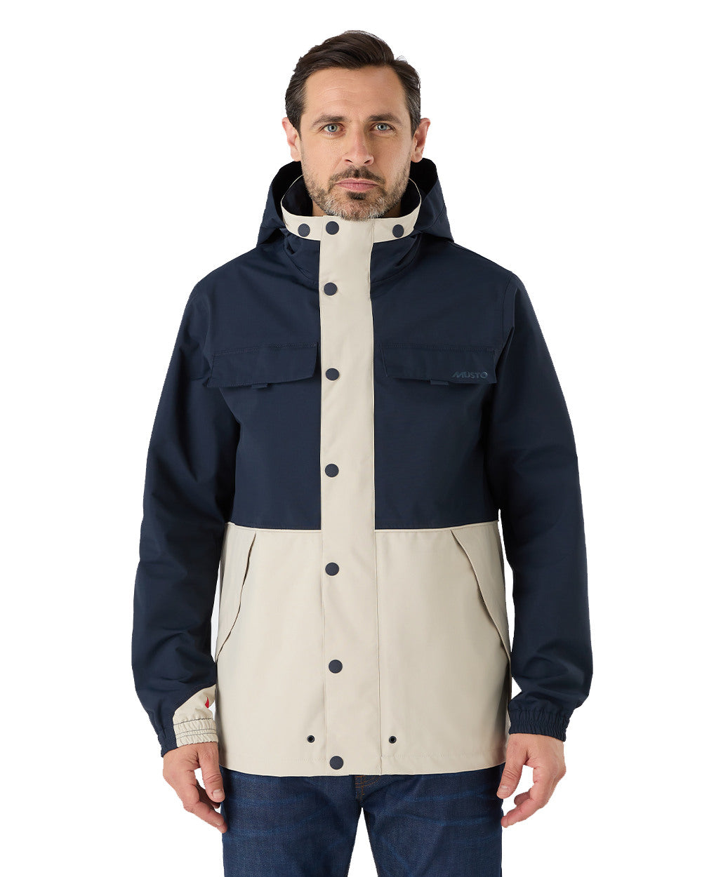 Pumice/Navy Coloured Musto Mens Classic Shore Waterproof Jacket On A White Background 