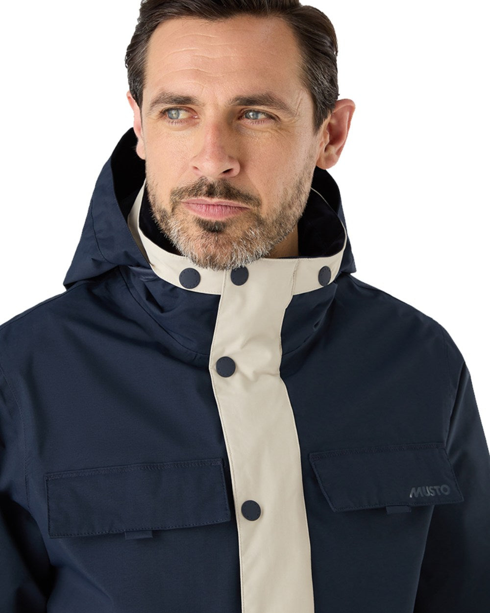 Pumice/Navy Coloured Musto Mens Classic Shore Waterproof Jacket On A White Background 