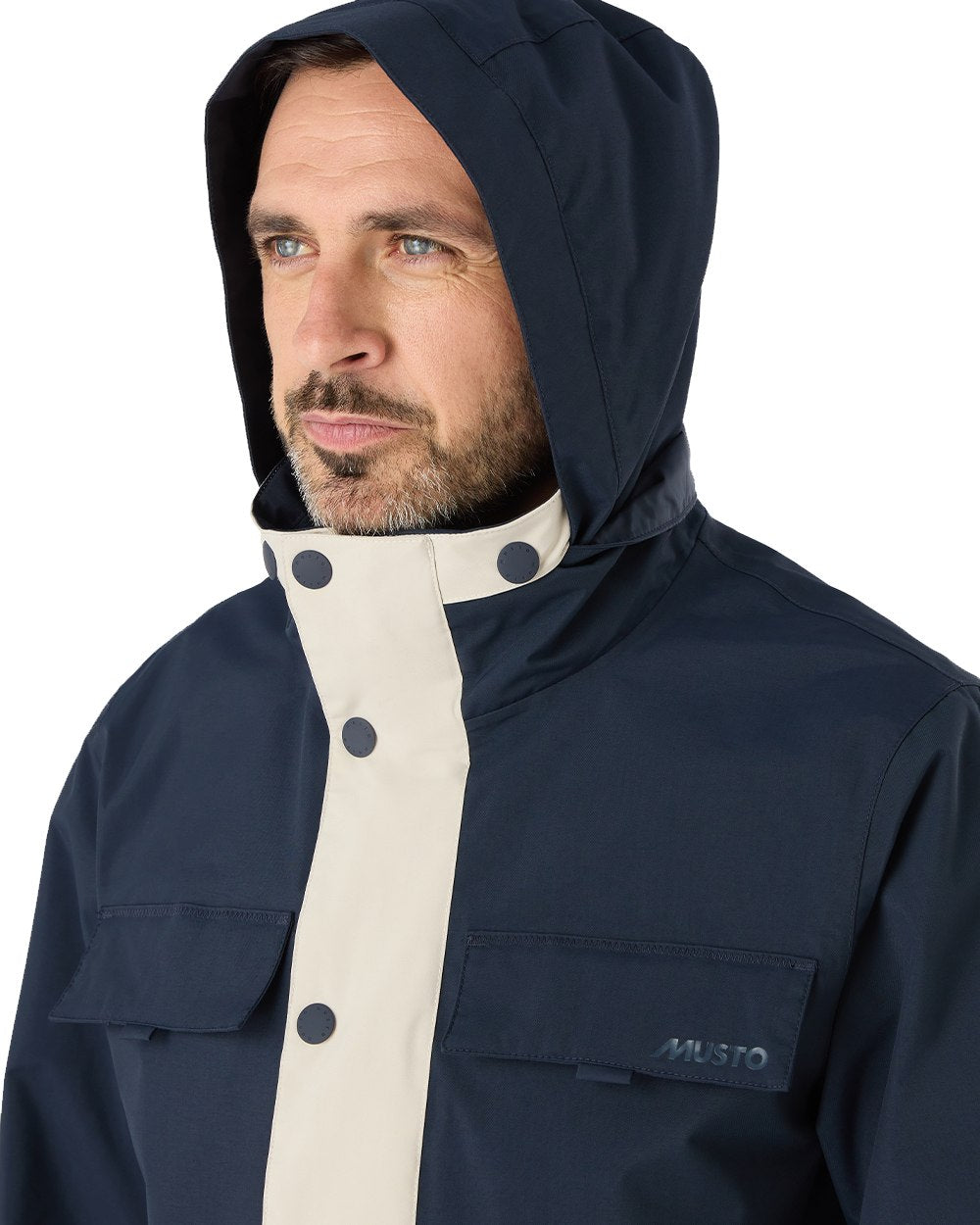 Pumice/Navy Coloured Musto Mens Classic Shore Waterproof Jacket On A White Background 