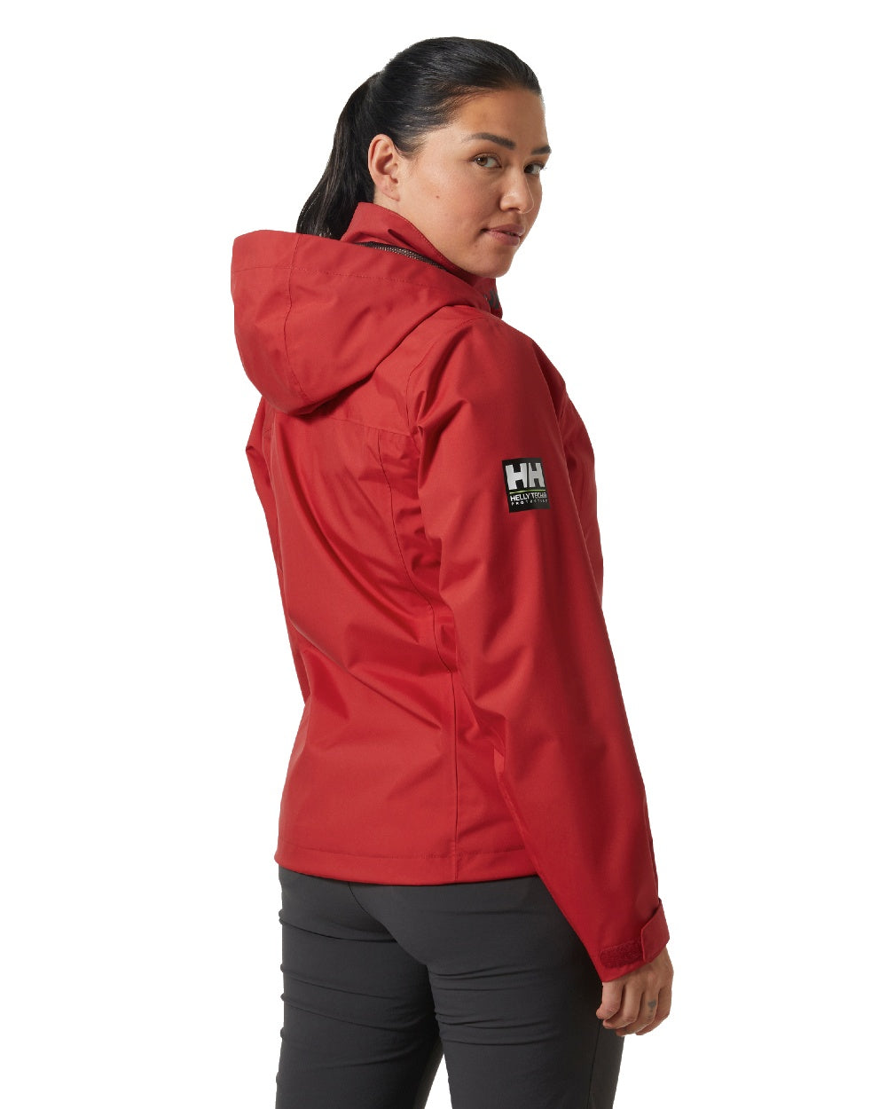 Red coloured Helly Hansen womens crew hooded sailing jacket 2.0 on white background 