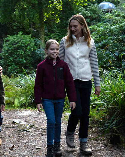 Dark Pimento Coloured Regatta Childrens Frankie Warm Full Zip Fleece Jacket on outdoor background 