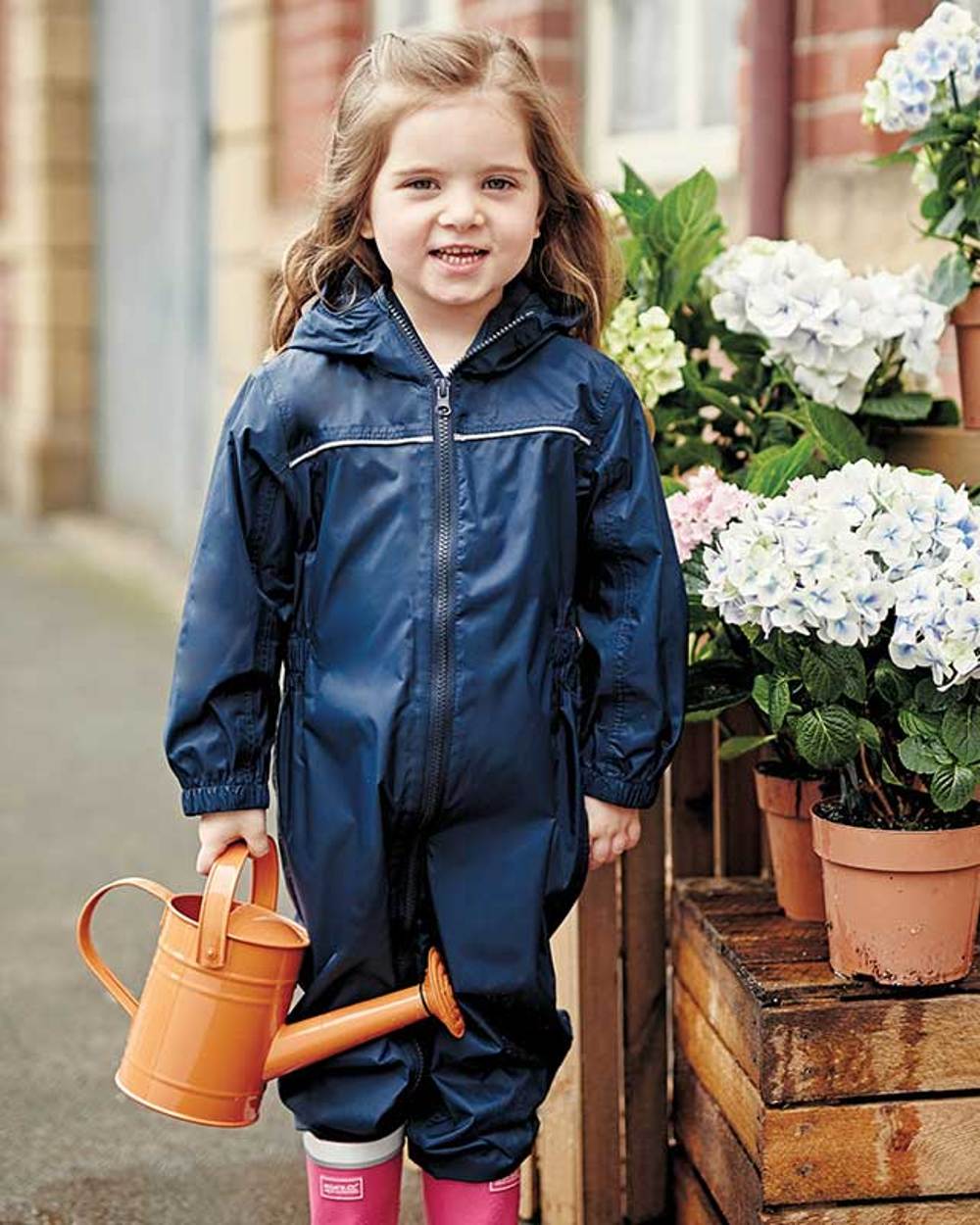 Navy coloured Regatta Kids Breathable Paddle Rain Suit on blurry background 