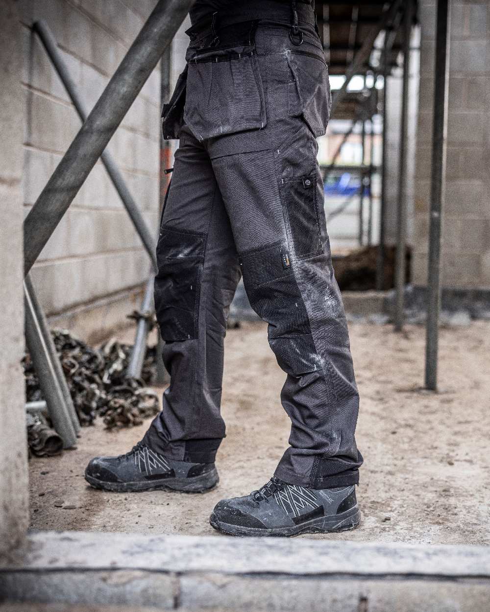 Iron coloured Regatta Mens Incursion Work Trousers on blurry background 