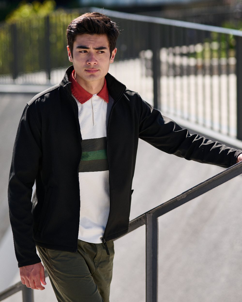 Black coloured Regatta Mens Reid Softshell Jacket on blurry background 