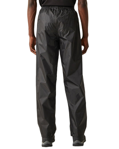 Black Coloured Regatta Mens Stormbreak Waterproof Overtrousers on white background 