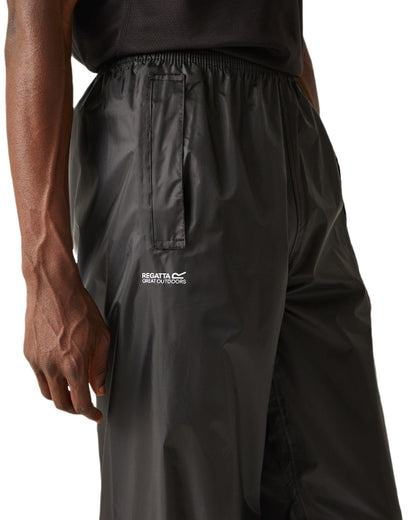 Black Coloured Regatta Mens Stormbreak Waterproof Overtrousers on white background 