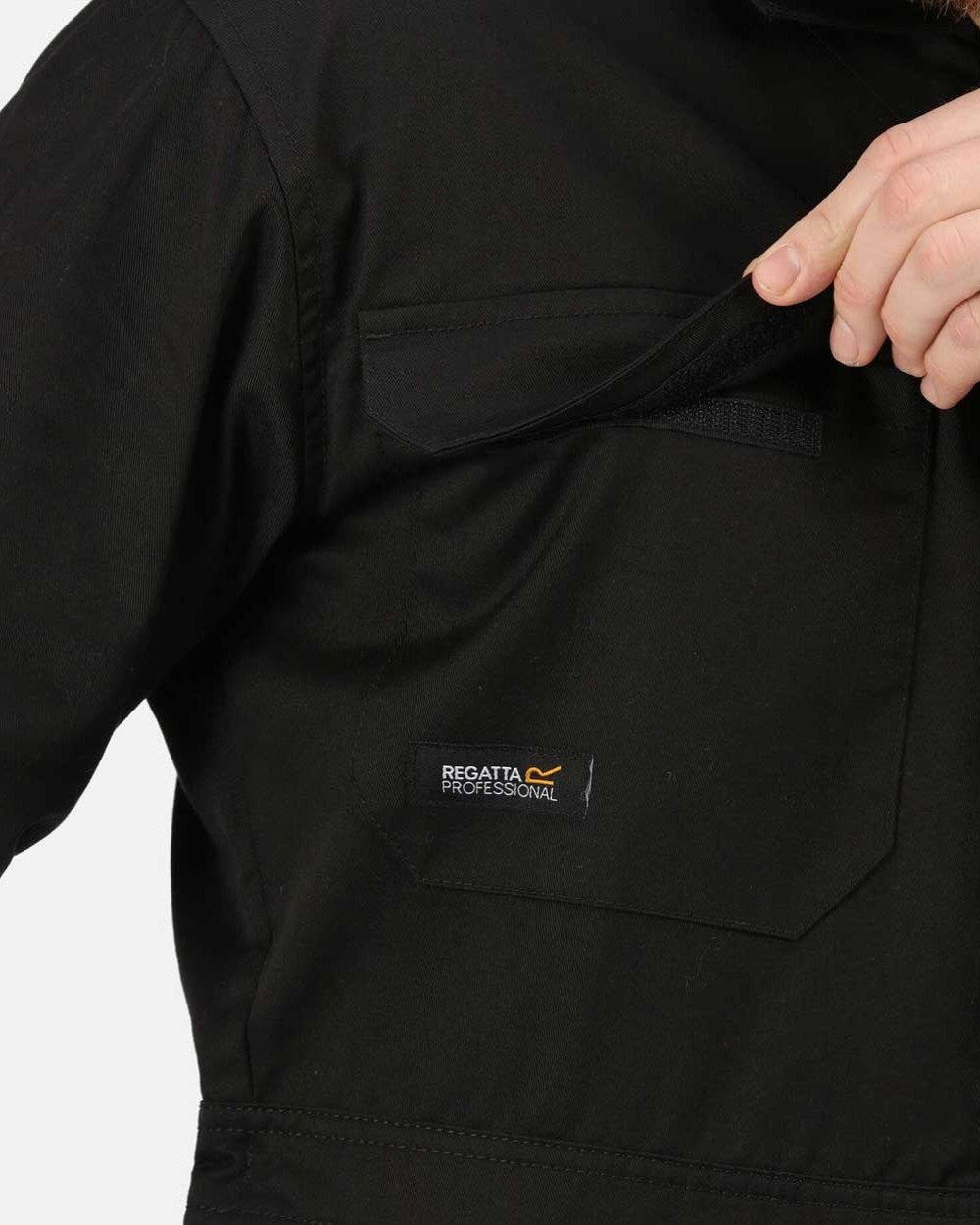 Black coloured Regatta Pro Stud Fasten Coverall on white background 