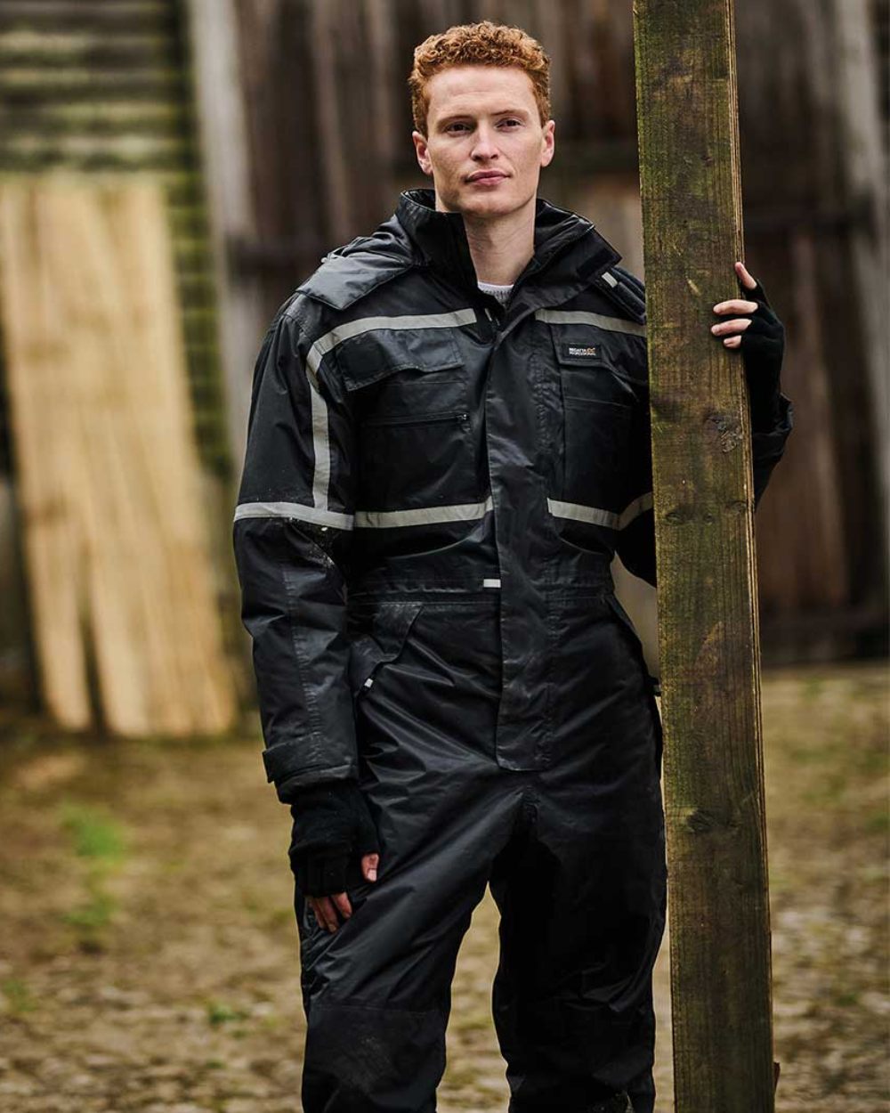 Black coloured Regatta Pro Waterproof Insulated Coverall on blurry background 