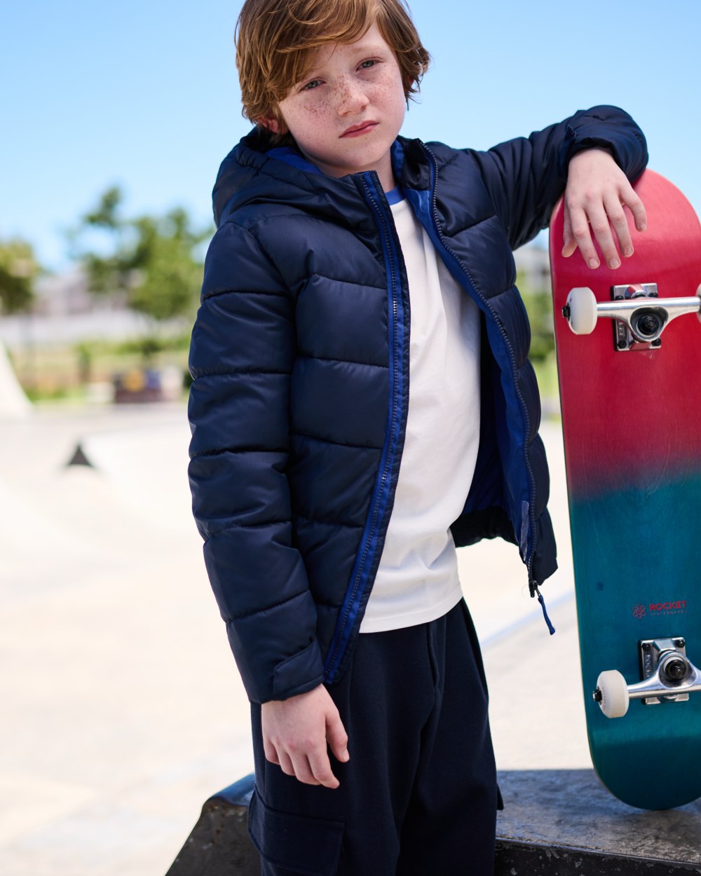 Navy New Royal coloured Regatta Professional Childrens Thermal Jacket on outdoor background 