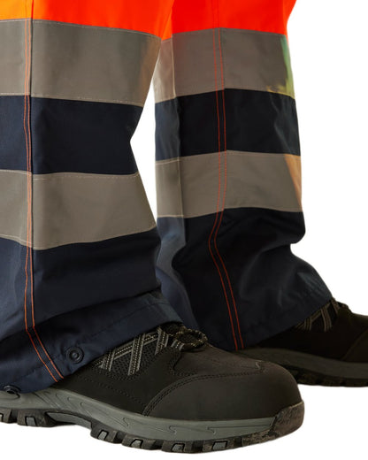 Orange Navy coloured Regatta Professional HI-VIS PRO Two Tone Insulated Overtrouser on white background 