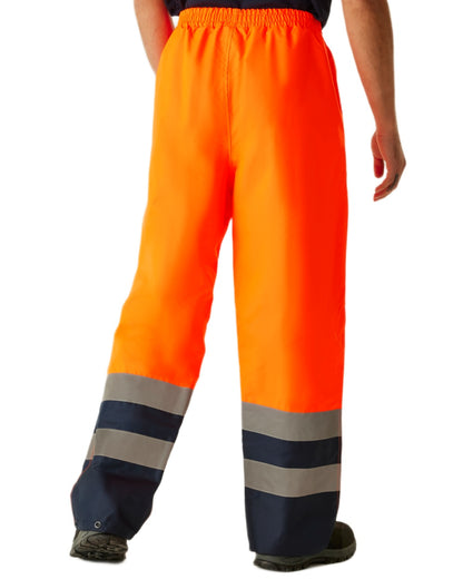 Orange Navy coloured Regatta Professional HI-VIS PRO Two Tone Insulated Overtrouser on white background 