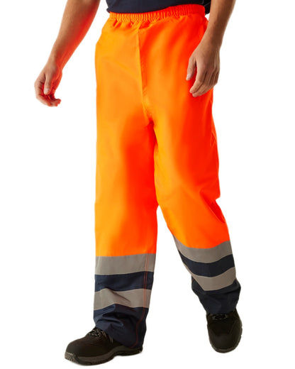 Orange Navy coloured Regatta Professional HI-VIS PRO Two Tone Insulated Overtrouser on white background 