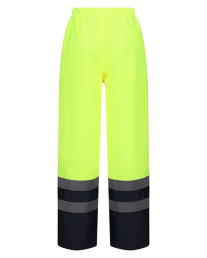 Yellow Navy coloured Regatta Professional HI-VIS PRO Two Tone Insulated Overtrouser on white background 