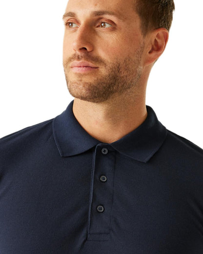 Navy coloured Regatta Professional Mens 65/35 Long Sleeves Polo Top on white background 