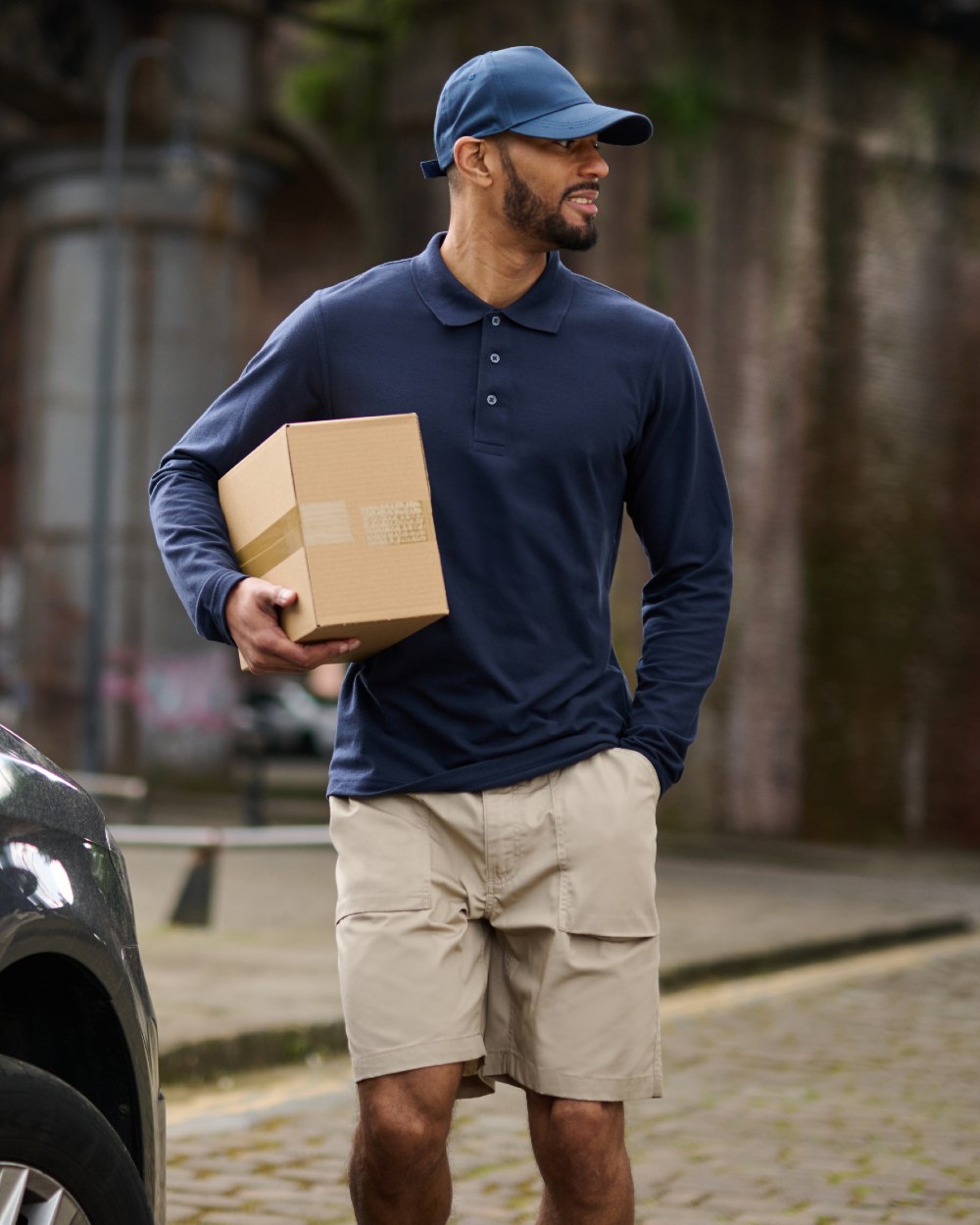 Navy coloured Regatta Professional Mens 65/35 Long Sleeves Polo Top on outdoor background 
