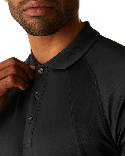 Black coloured Regatta Professional Mens Coolweave Wicking Polo Shirt on white background 