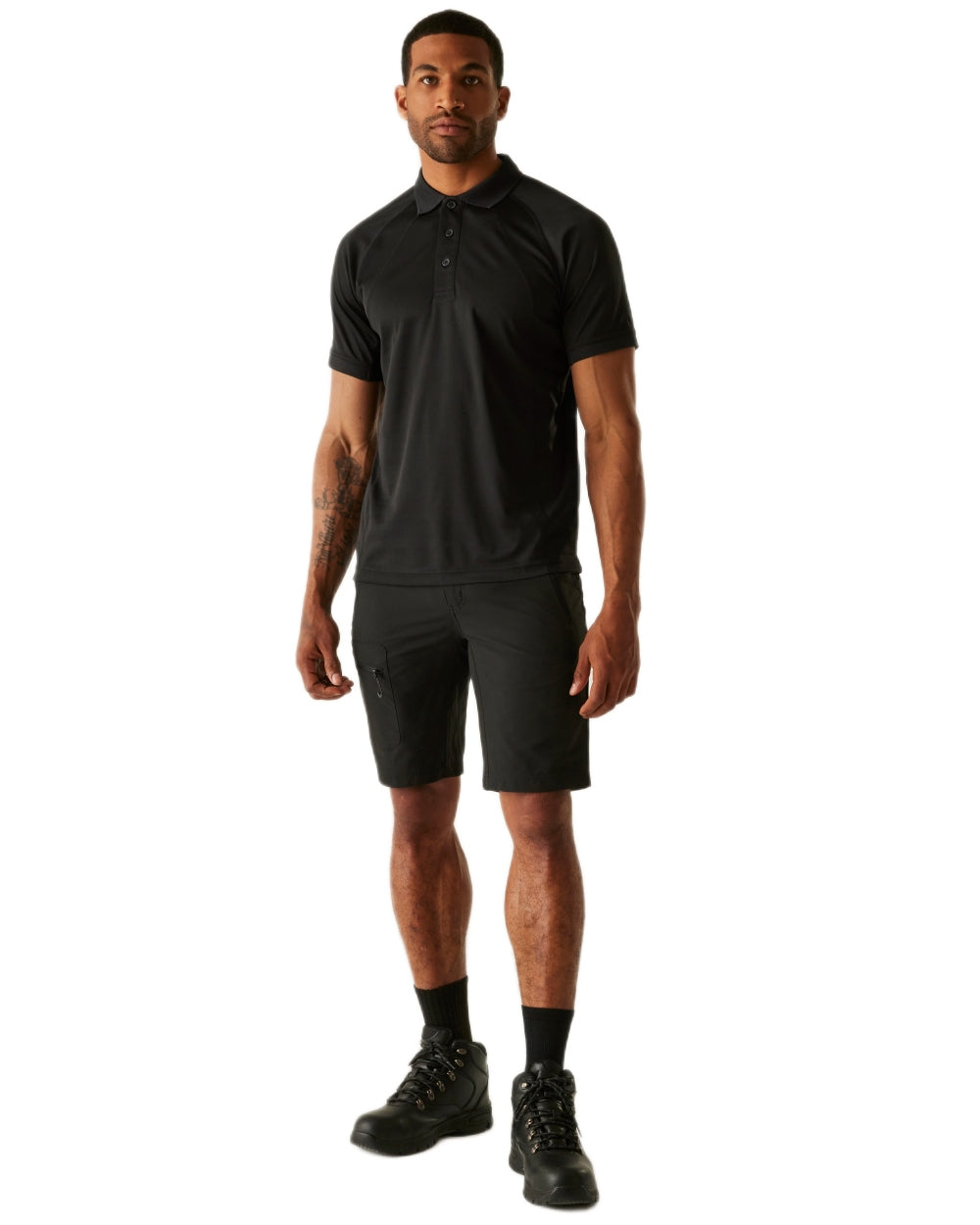 Black coloured Regatta Professional Mens Coolweave Wicking Polo Shirt on white background 