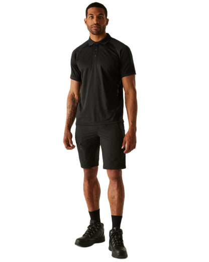 Black coloured Regatta Professional Mens Coolweave Wicking Polo Shirt on white background 