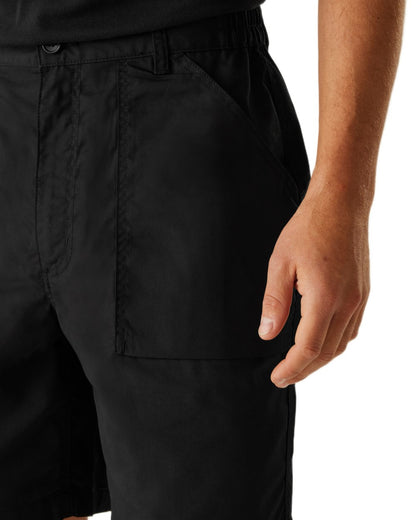 Black coloured Regatta Professional Mens Multi Pocket Action Shorts on white background 