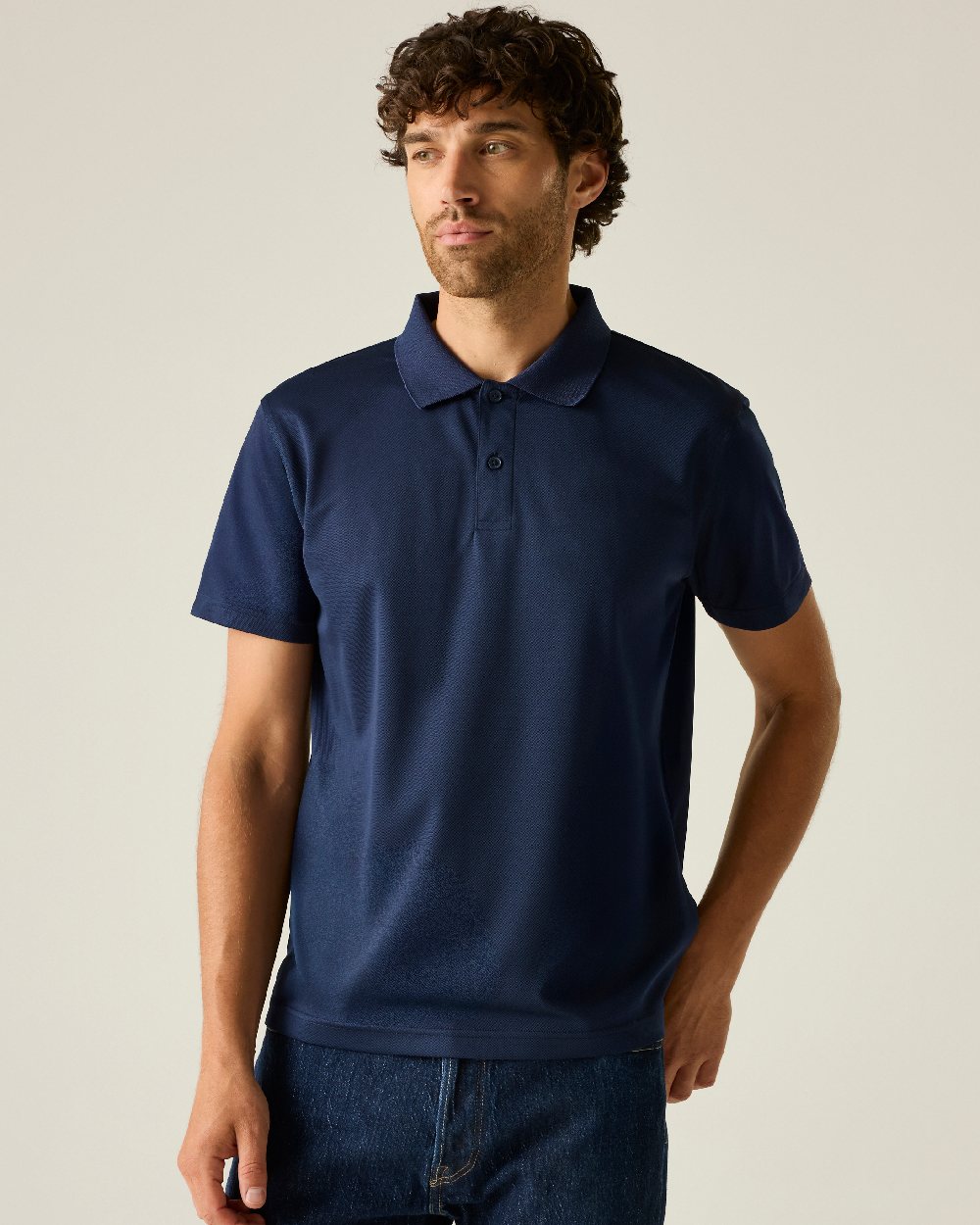 Navy colour Regatta Professional Mens Pro Wicking Pique Polo Shirt on beige background 