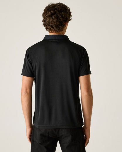 Black colour Regatta Professional Mens Pro Wicking Pique Polo Shirt on beige background 