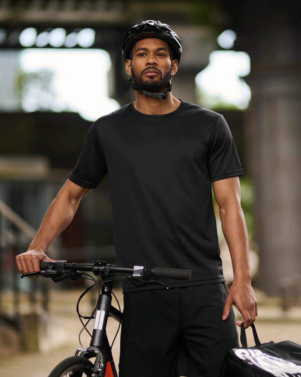 Black coloured Regatta Professional Mens Pro Wicking T-Shirt on outdoor background 