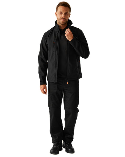 Black coloured Regatta Professional Mens Thermogen Heated Softshell Jacket on white background 