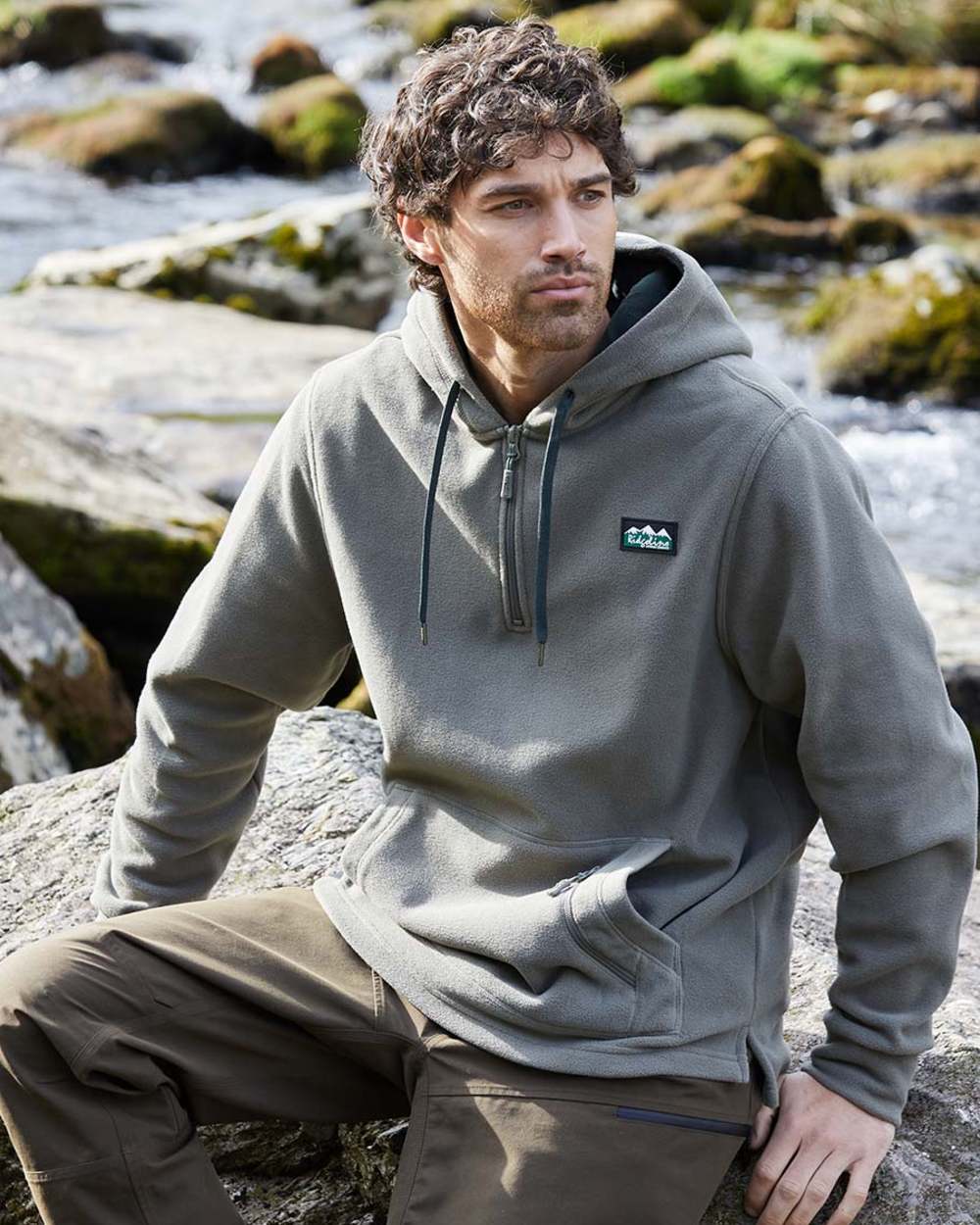 Smokey Olive Coloured Ridgeline Ballistic Hooded Fleece on outdoor background 