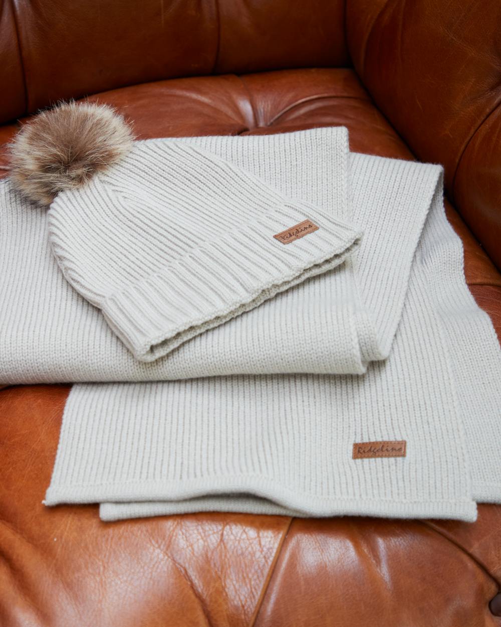 Sand coloured Ridgeline Baltic Bobble Hat &amp; Scarf Set on indoor background 