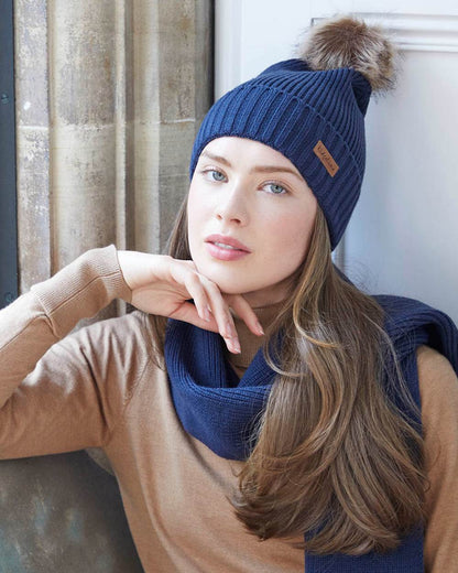 Tarn coloured Ridgeline Baltic Bobble Hat &amp; Scarf Set on indoor background 