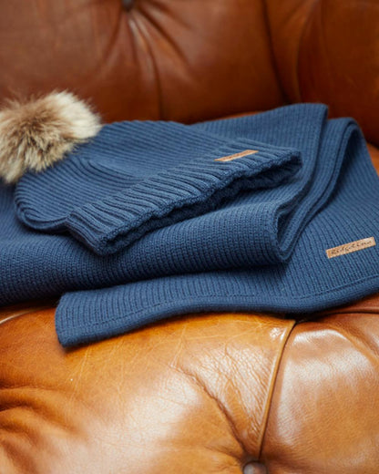 Tarn coloured Ridgeline Baltic Bobble Hat &amp; Scarf Set on indoor background 