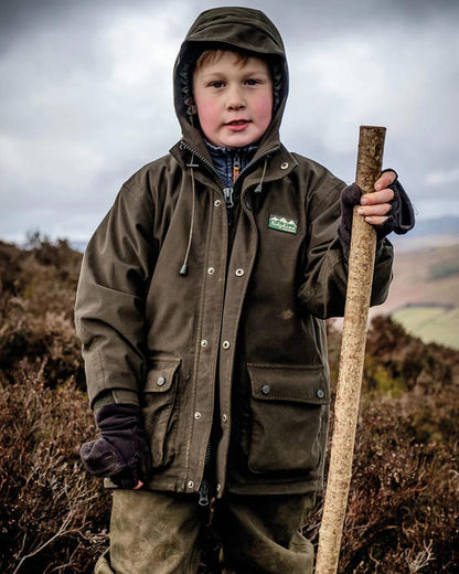 Deep Forest coloured Ridgeline Childrens Spiker Jacket on outdoor background 