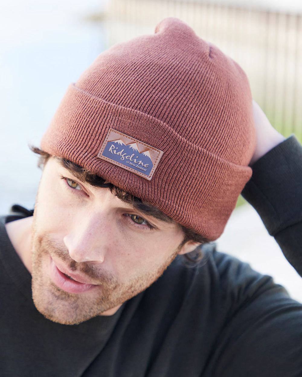 Nutmeg coloured Ridgeline Heritage Fine Knit Beanie on outdoor background 