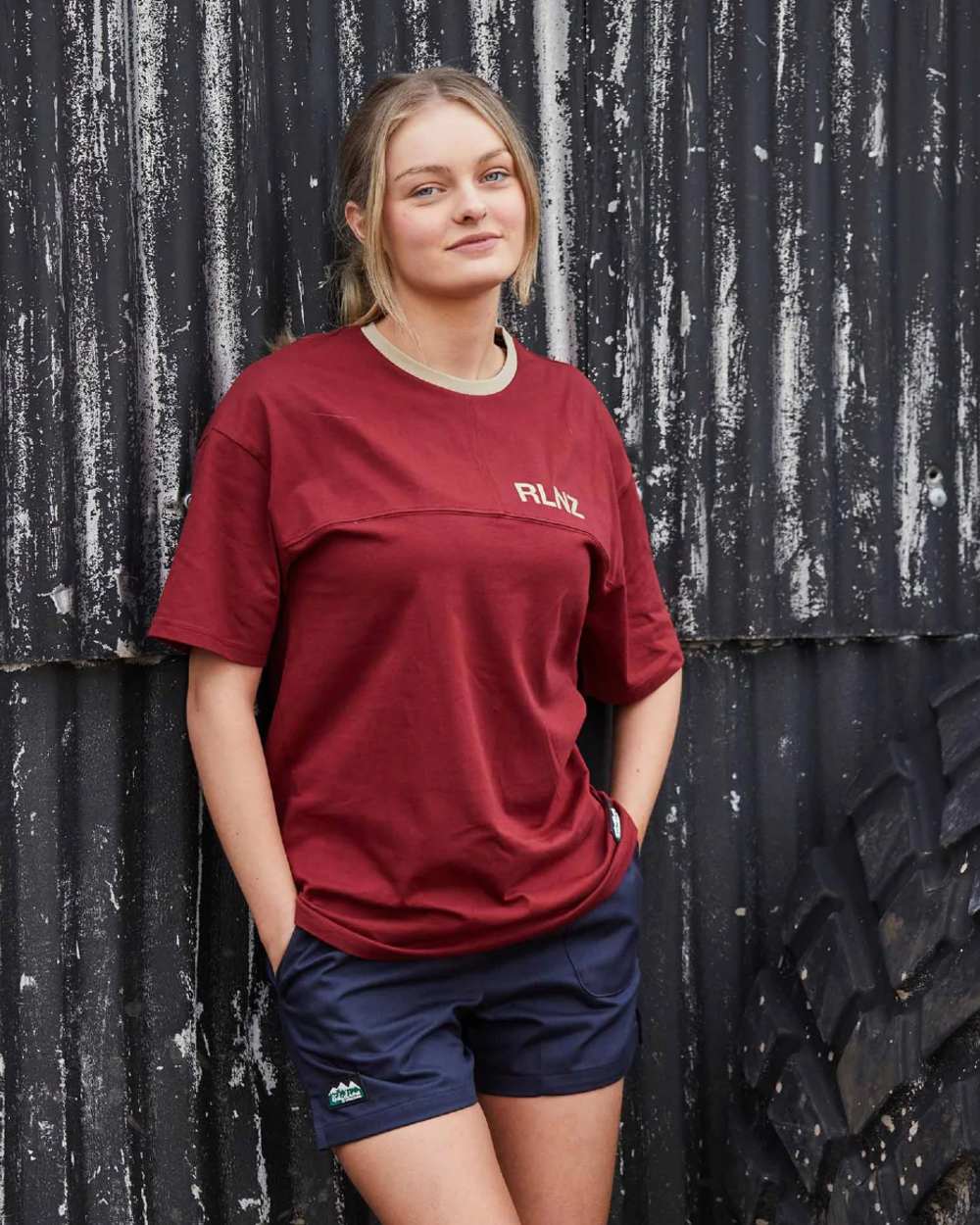 Rhubarb coloured Ridgeline Hose Down T-Shirt on black wall background 
