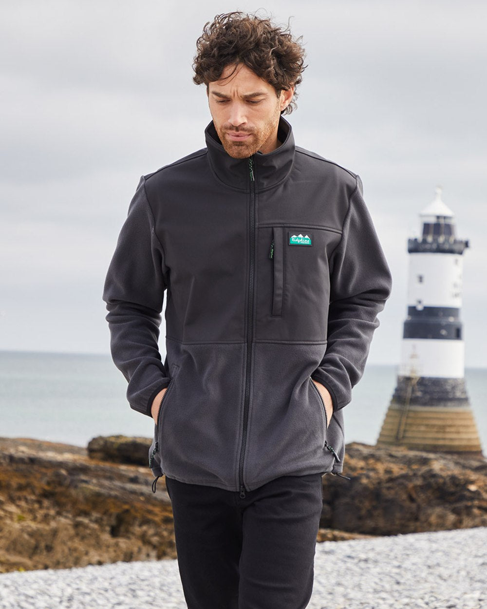 Shale coloured Ridgeline Hybrid Fleece Jacket on sea background 