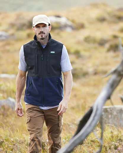 Navy coloured Ridgeline Hybrid Fleece Vest on blurry background 